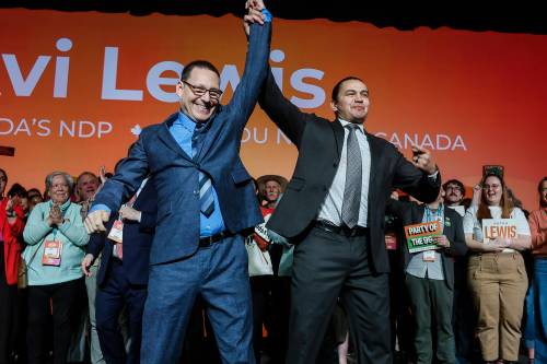 Avi Lewis (left) celebrates with Manitoba Premier Wab Kinew after being proclaimed the new leader of the federal NDP on March 29. According to a new poll, the federal NDP has seen a surge in support in Winnipeg. (The Canadian Press files)