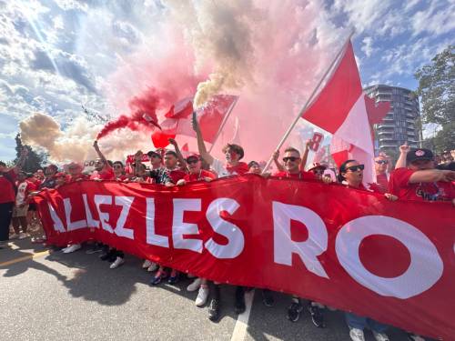 CARRIE SERWETNYK PHOTO
                                Canadian superfans Les Voyageurs make their way to BC Place with a massive &ldquo;Allez les Rouges&rdquo; on Wednesday for the Canada-Switzerland match.