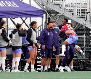Vitor Munhoz / Northern Super League
                                Evelyn Badu leaps into the arms of her teammate at Stade Boréale. Badu had a hat trick last Saturday against the Vancouver Rise.
