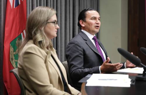 Premier Wab Kinew and Emergency Management Organization director Christine Stevens answer questions from the media about flooding support at Manitoba Legislative Building in Winnipeg on Friday. (Ruth Bonneville/Winnipeg Free Press)