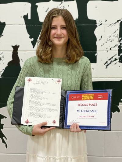 Meadow Smid is seen with her award for her poem entitled &lsquo;For My Country&rsquo; that won second place in the National Youth Remembrance Contest. The award was given this spring after she submitted the poem in fall 2025. (Photo courtesy of the Minnedosa Tribune)