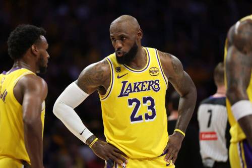 Lakers Bronny and LeBron James talk during a break in game action. Lakers hosting the Rockets in game one of the NBA first round playoffs at Crypto.com Arena in Los Angeles, California on Saturday, April 18, 2026. (Allen J. Schaben/Los Angeles Times/TNS)