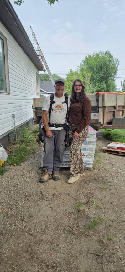 C.F.L. Renovations owners Colin (left) and Faye Leforte stand beside a building site in Napinka where he worked on Tuesday. (Supplied)