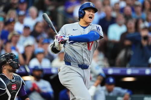 Los Angeles Dodgers&rsquo; Shohei Ohtani reacts as he fouls off a pitch from Colorado Rockies starting pitcher Kyle Freeland in the third inning of a baseball game Wednesday, Aug. 19, 2026, in Denver. (AP Photo/David Zalubowski)