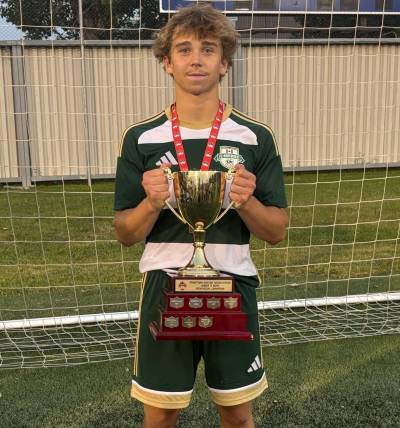 Leaf Klassen holds the Manitoba Soccer Association Cup after becoming a provincial champion as a member of FC Northwest. (Submitted)