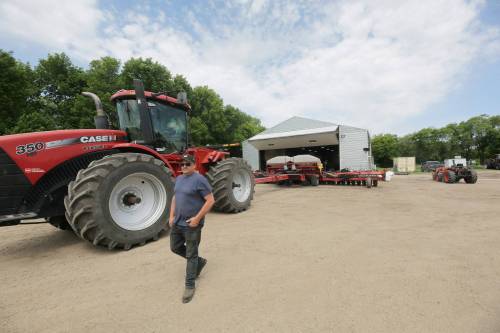 Devin Toews, brother of Dean Toews, is seen in June at the Toews family farm near MacGregor. Some crops are about two to three weeks behind schedule for harvest this year as a result of weather sustained this farming season. (Connor McDowell/The Brandon Sun files)