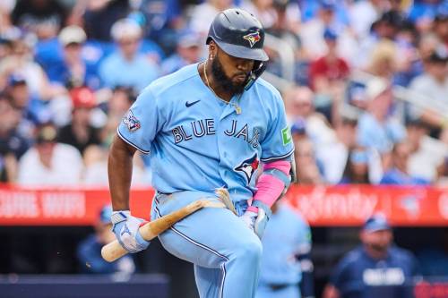 Blue Jays first baseman Vladimir Guerrero Jr. breaks his bat in frustration after grounding out against the St. Louis Cardinals in Toronto on Aug. 1, 2026. THE CANADIAN PRESS/Sammy Kogan