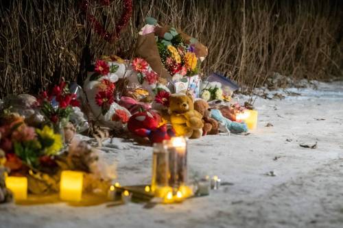 A memorial is setup during a candle light vigil for Amanda Clearwater, 30, her children Bethany, 6, Jayven, 4, Isabella, two months, and her niece Myah Gratton, 17, in Carman in February 2024. (Brook Jones/Winnipeg Free Press files)