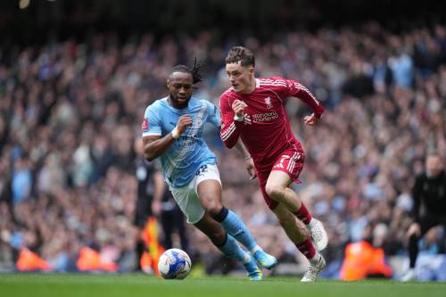 JON SUPER / THE ASSOCIATED PRESS FILES
                                Manchester City&rsquo;s Antoine Semenyo (left) and Liverpool&rsquo;s Florian Wirtz fight for the ball the last time the two sides met back in April. The Sky Blues are certain to get a rough welcome by Reds fans as the two clubs meet at Anfield next Sunday for the first time since Man City&rsquo;s guilty verdict of breaking more than 100 Premier League financial rules between 2009 and 2018 &mdash; a span that saw Manchester take the league title and Carabao Cup over Liverpool.