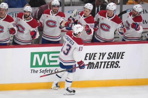 Montréal Canadiens&rsquo; Cole Caufield (13) returns to his bench after scoring during the first period of an NHL hockey game against the Pittsburgh Penguins in Pittsburgh on Oct. 3. Bruce Penton risks jinxing the Canadiens&rsquo; season by declaring them Stanley Cup contenders. (The Associated Press)